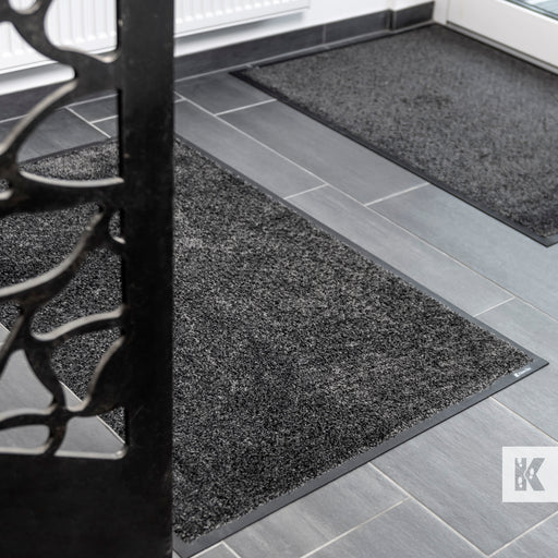 Green-Horse - Two entrance mats on a hard floor
