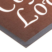 Ad-Mat - Closeup of the corner of an Ad-Mat, shoeing the rubber edge and fine printed fabric surface.