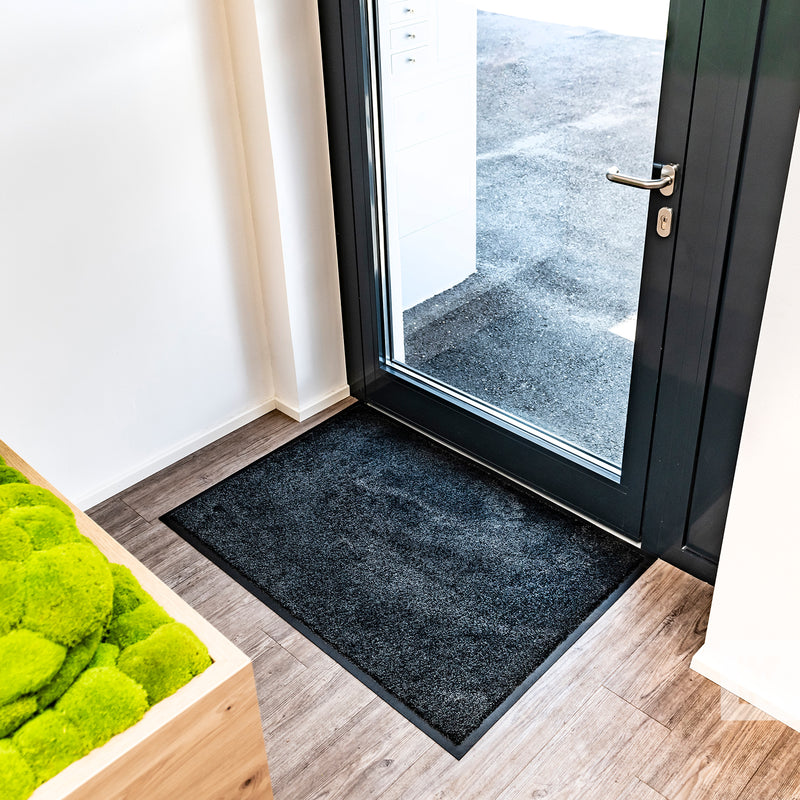 EcoAbsorb Mat - Black mat in front of glass door