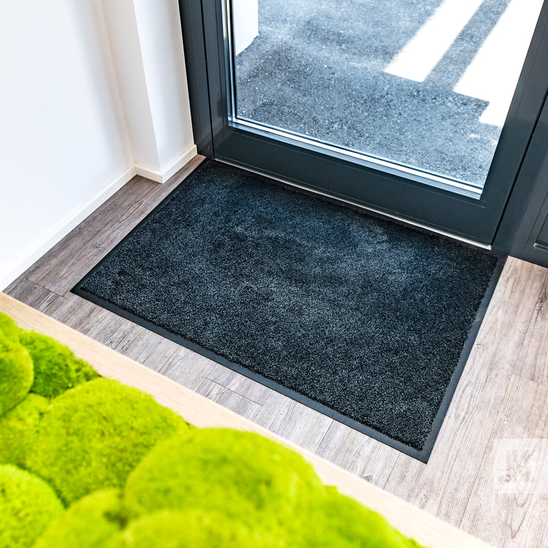 EcoAbsorb Mat - Mat in front of a glass door in a modern office building