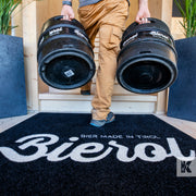 Jet-Print Light - Bierol branded mat design, a man carries two beer kegs up a flight of steps
