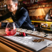 Bar-Mat - Bar scene with red gin and berries on a Stollen Bar mat, being prepared for a waiting customer