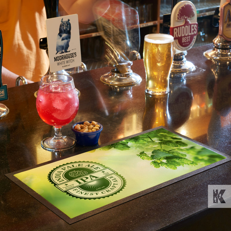 Bar-Mat - Green mat positioned on a bar top with IPA branded graphics