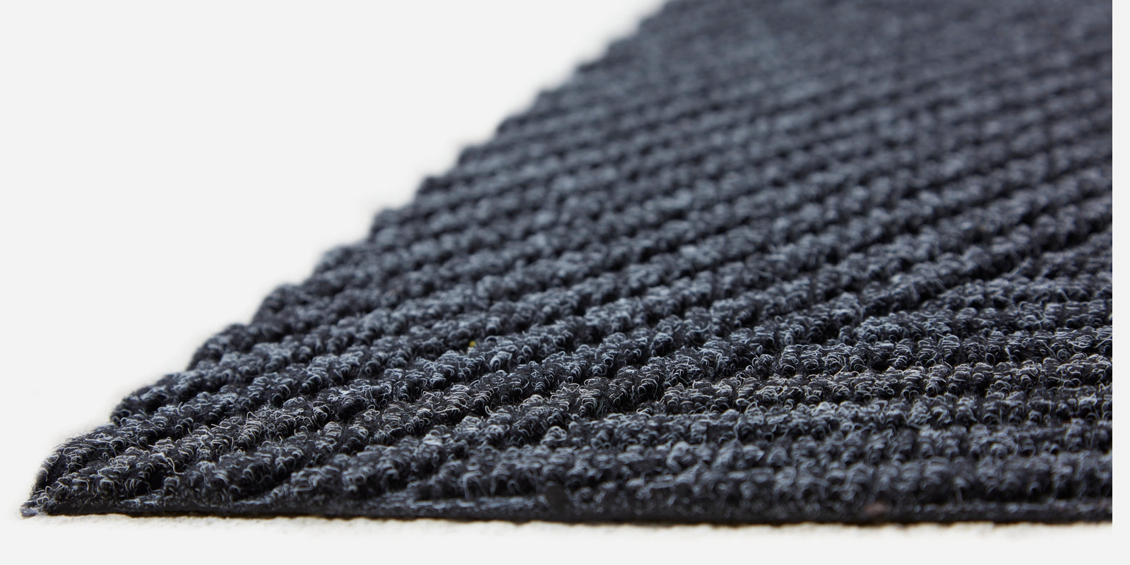 Close up image of a DUNE mat showing the 3d texture of the sculpted pile