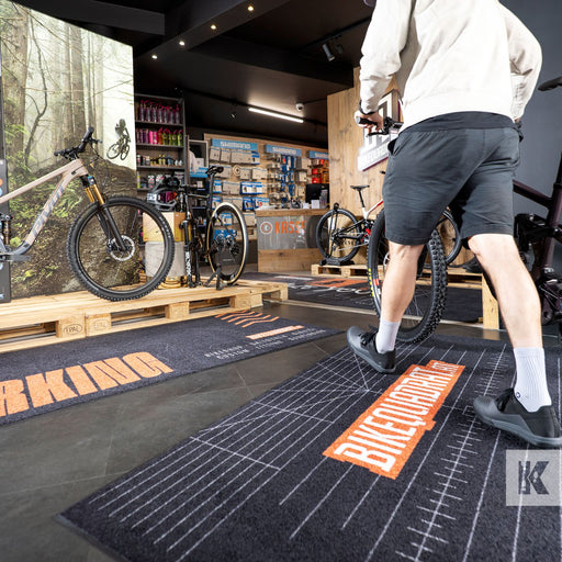 Bikequadrant logo on a custom designed floor mat