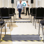 Kleen-Cable Mat - Kleen-Tex - In a conference room with rows of chairs.