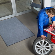 Iron-Horse - Black Steel - Mechanic working with a mat in the background